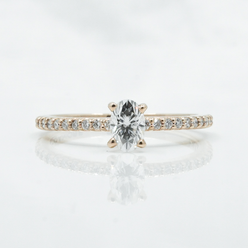 dainty-oval-engagement-ring-with-diamond-band