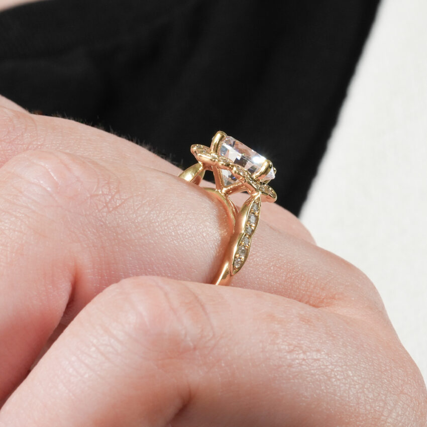 Angle view of floral engagement ring in lifestyle
