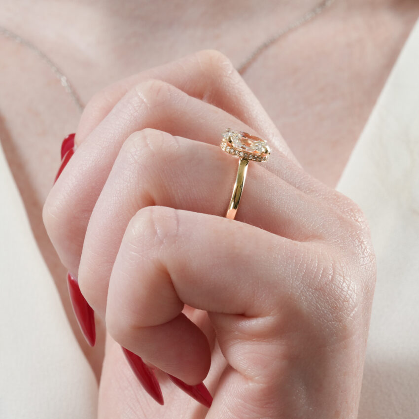Angle view of secret halo engagement ring in lifestyle