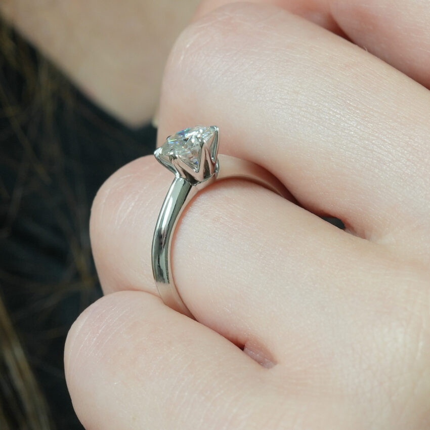 Angle view of six prong engagement ring in lifestyle