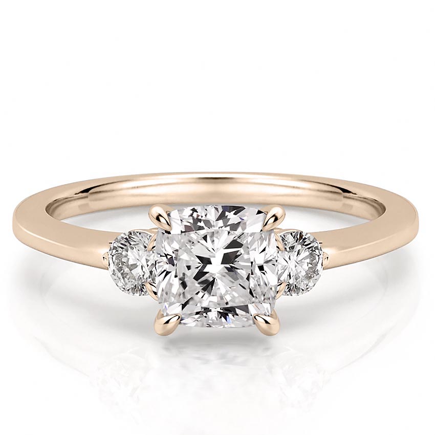 three-stone-cushion-engagement-ring in rose gold