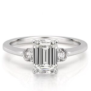 three-stone-emerald-engagement-ring in platinum