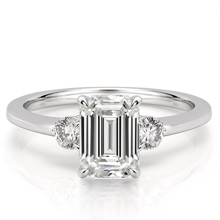 three-stone-emerald-engagement-ring in platinum