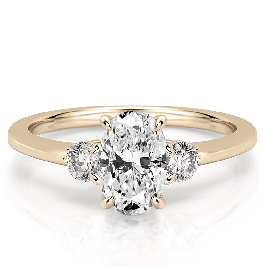 three-stone-oval-engagement-ring in yellow gold