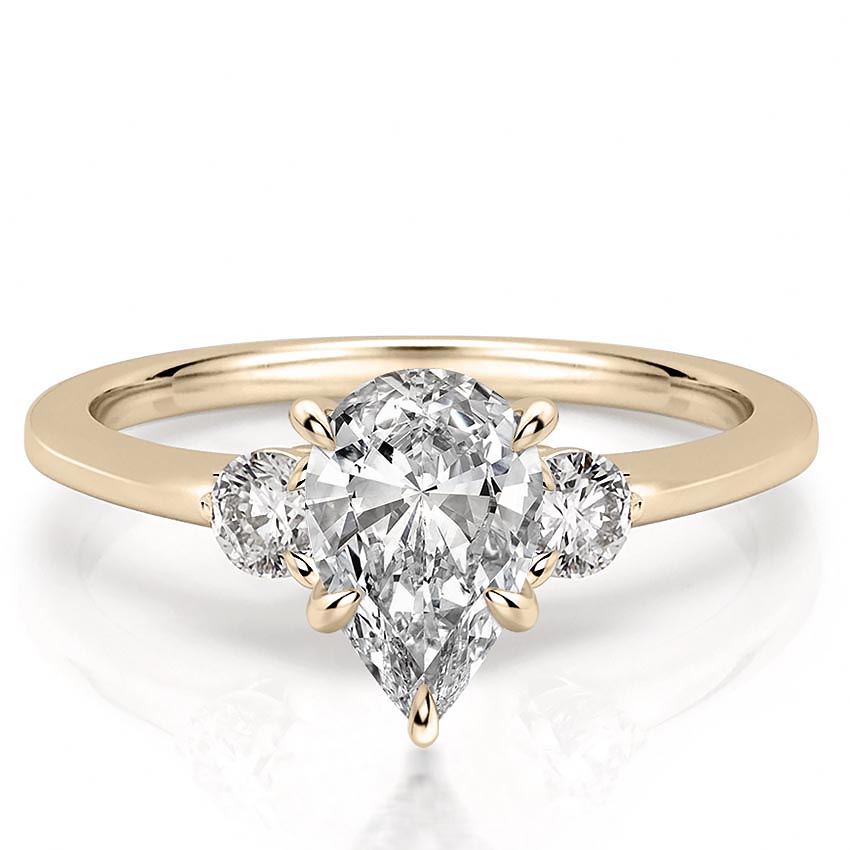 three-stone-pear-engagement-ring in yellow gold