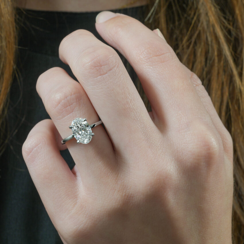 ultra low hidden halo engagement ring in lifestyle