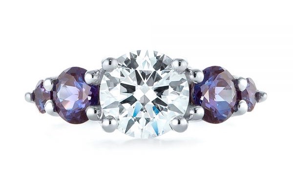 diamond engagement ring with alexandrite side stones in white gold