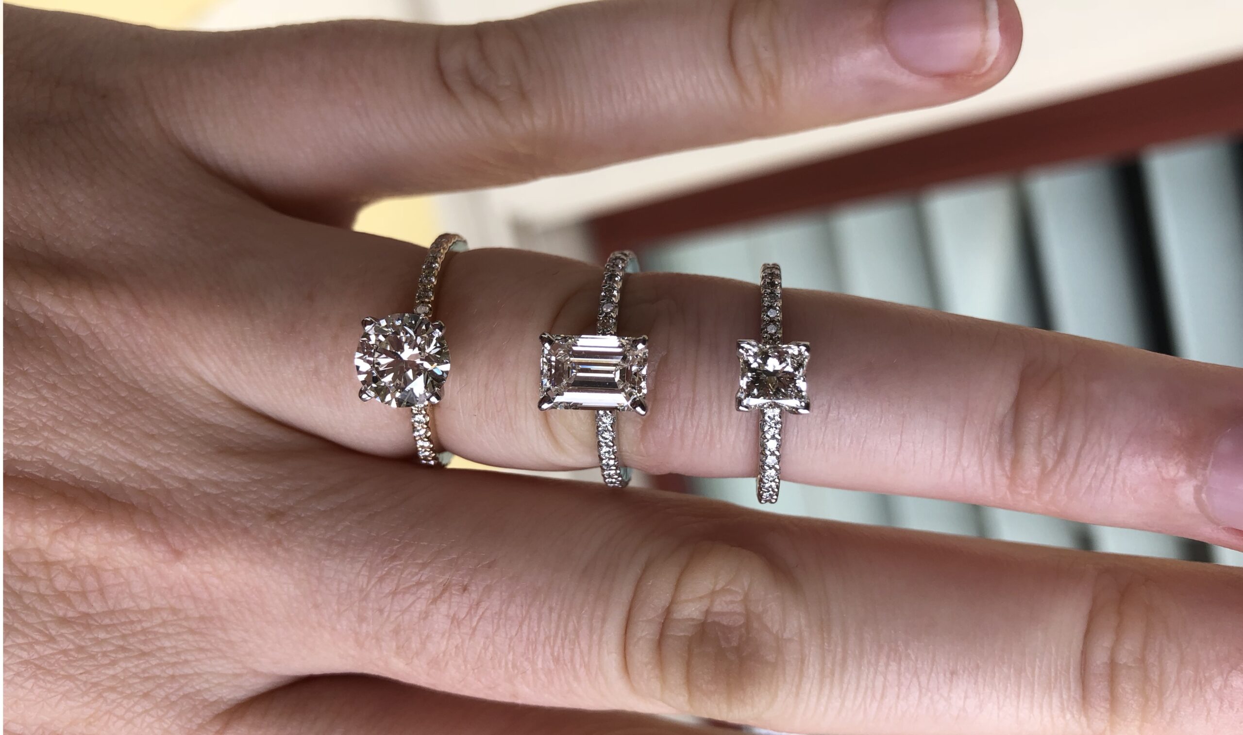 Round vs Emerald cut vs Princess cut diamonds on a finger