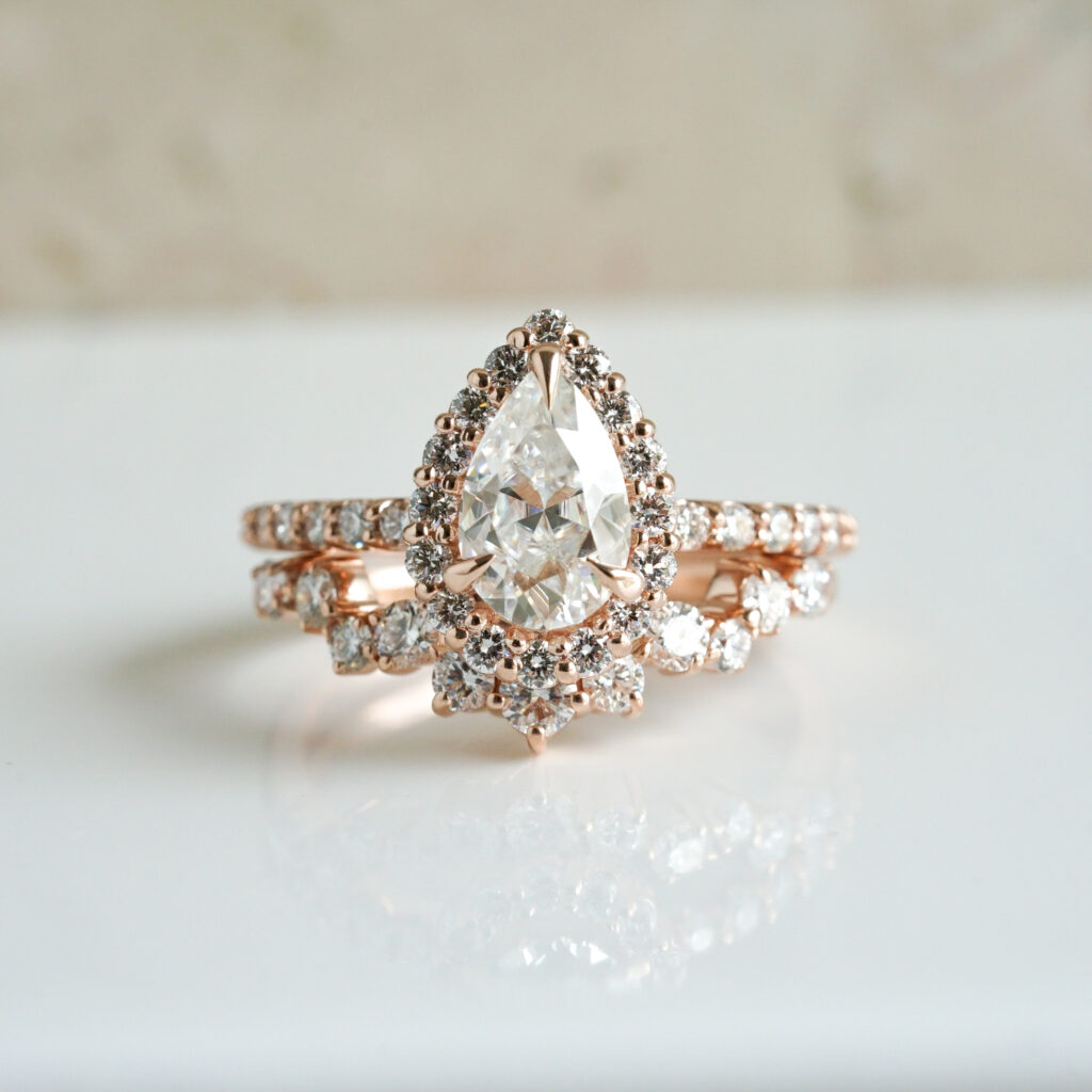 Moissanite engagement ring and wedding band in rose gold