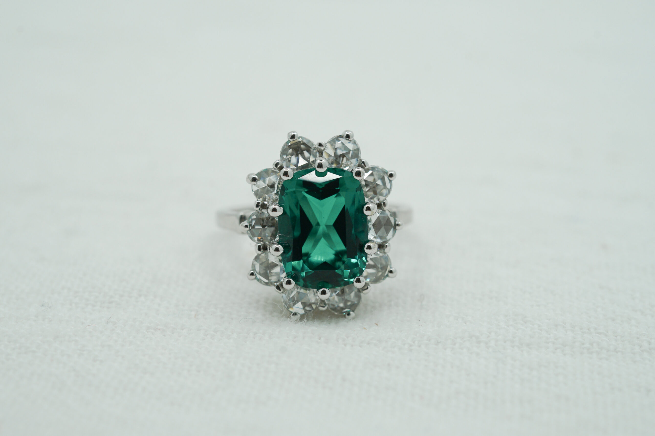 Emerald ring with rose cut accent diamonds