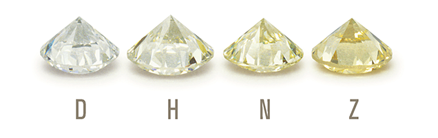 four diamonds ranging in color from white to yellow