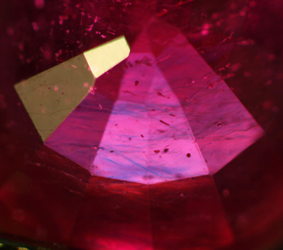 Photo of blue flash in glass filled ruby