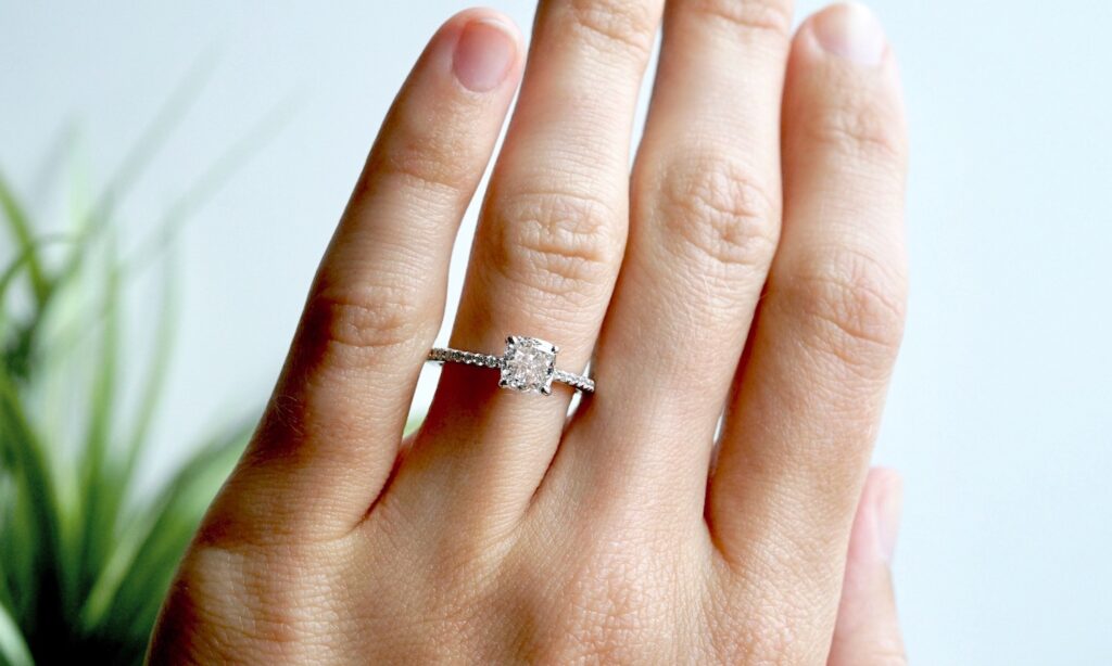 engagement ring with cushion cut diamond in white gold