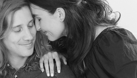 black and white photo of couple leaning in and touching foreheads