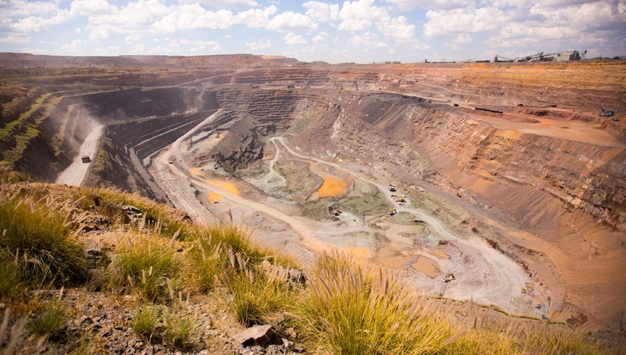 diamond mine at sunset with grass in foreground