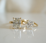 two yellow gold engagement rings with lab created radiant diamonds