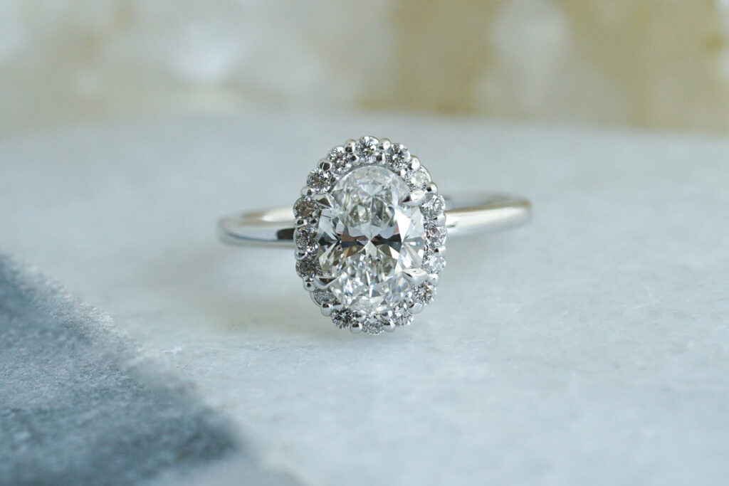 oval diamond engagement ring with halo in white gold