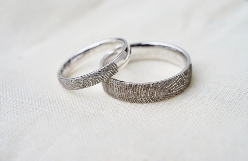 possible promise rings with fingerprint engraved in outside of band in white gold