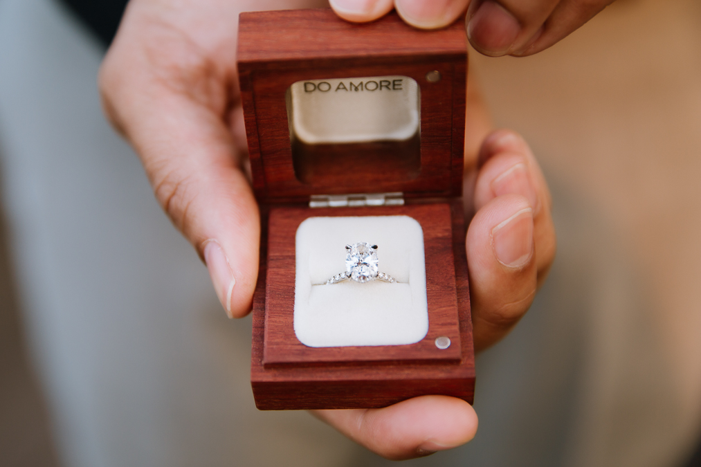 ethical jeweler with sustainable boxes with oval engagement ring inside