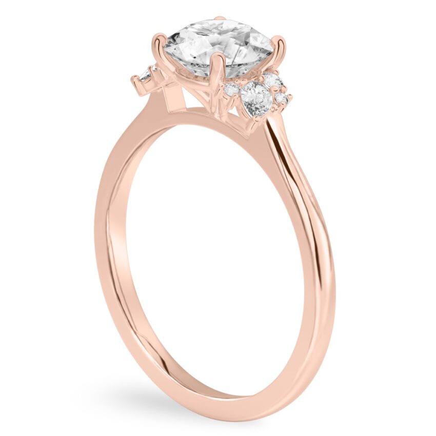 gallery view of rose gold engagement ring with cluster of round and pear diamonds on either side