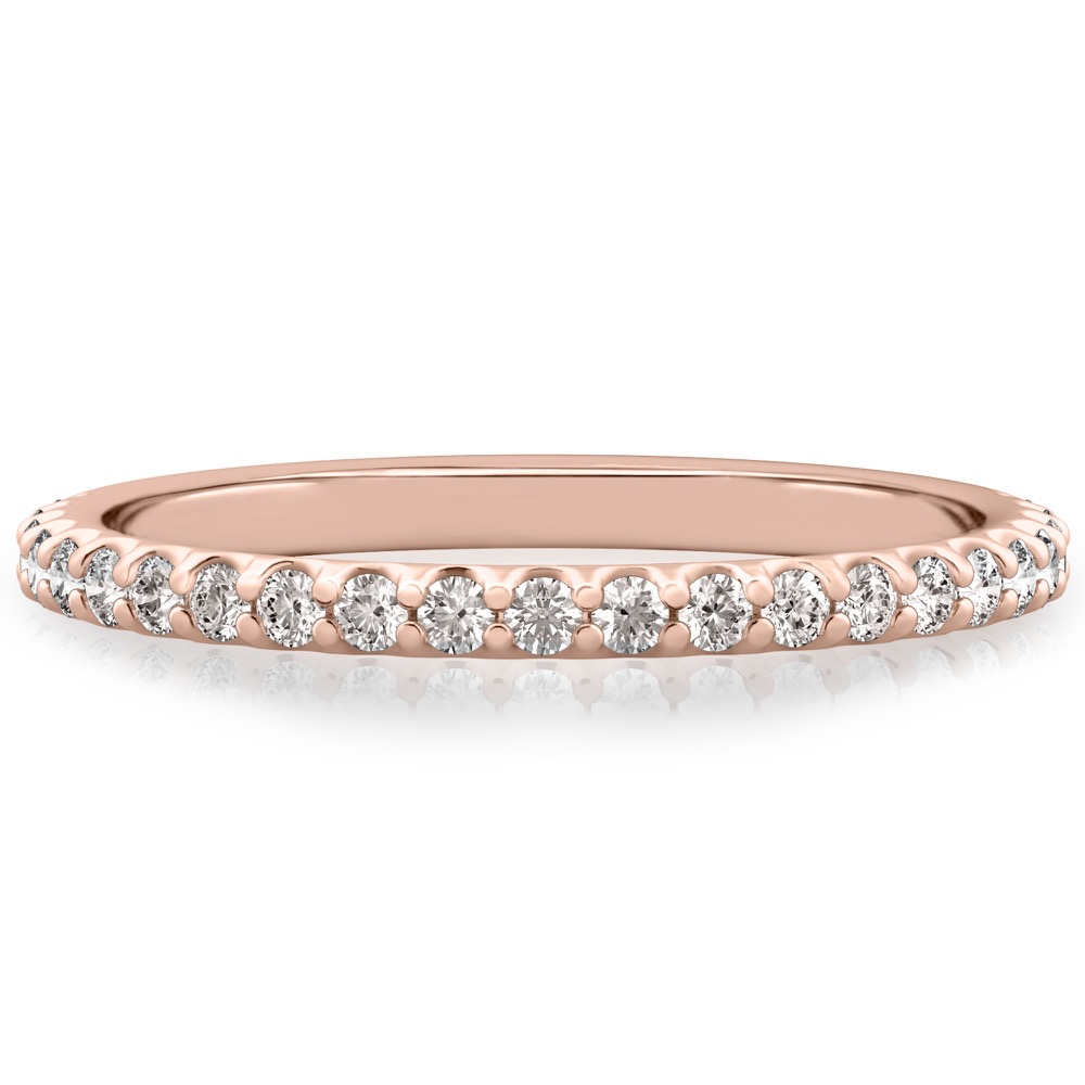 wedding band with round diamonds and shared prongs in rose gold