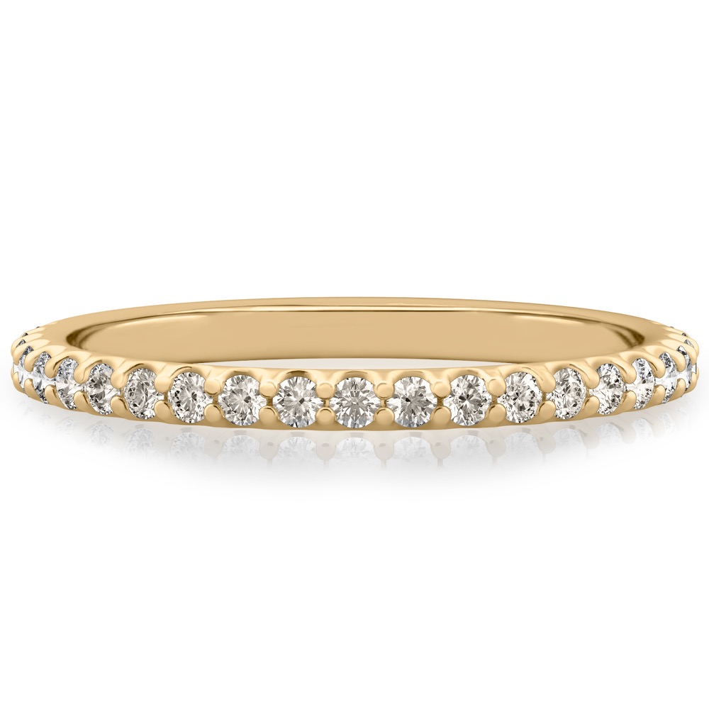 wedding band with round diamonds and shared prongs in yellow gold