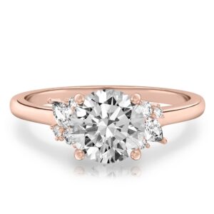 rose gold engagement ring with clusters of round and pear diamonds around the center stone