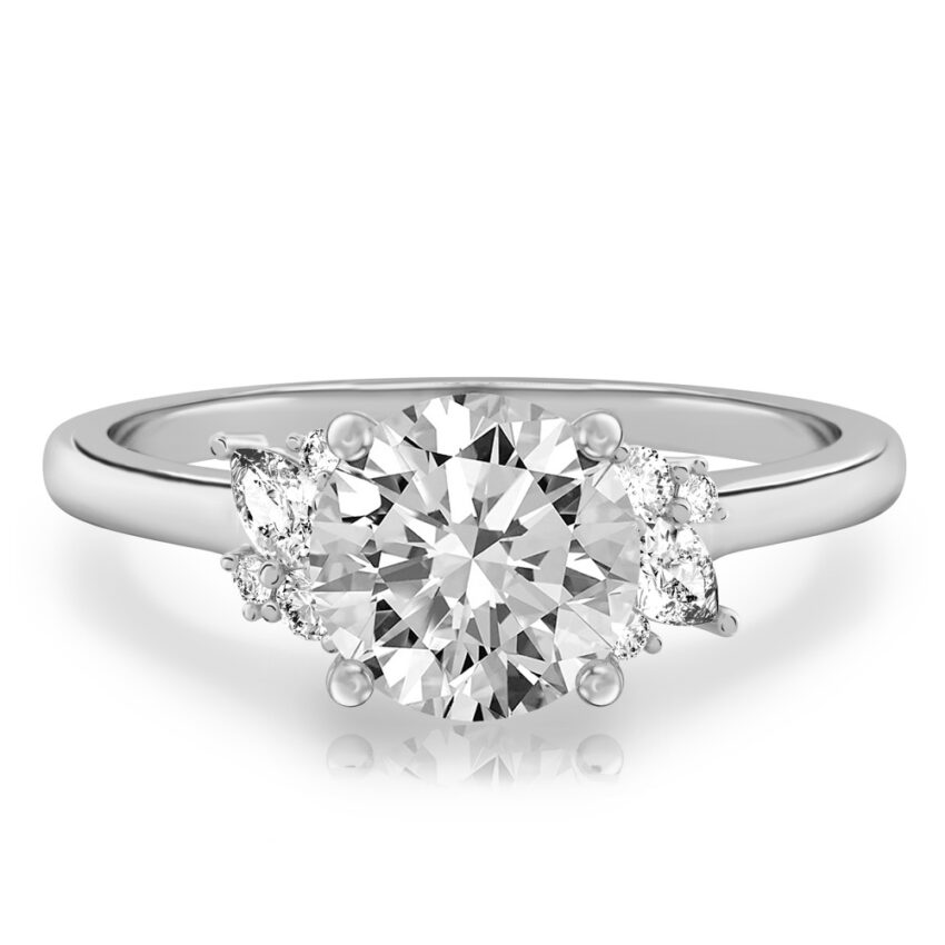 white gold engagement ring with clusters of round and pear diamonds around the center stone