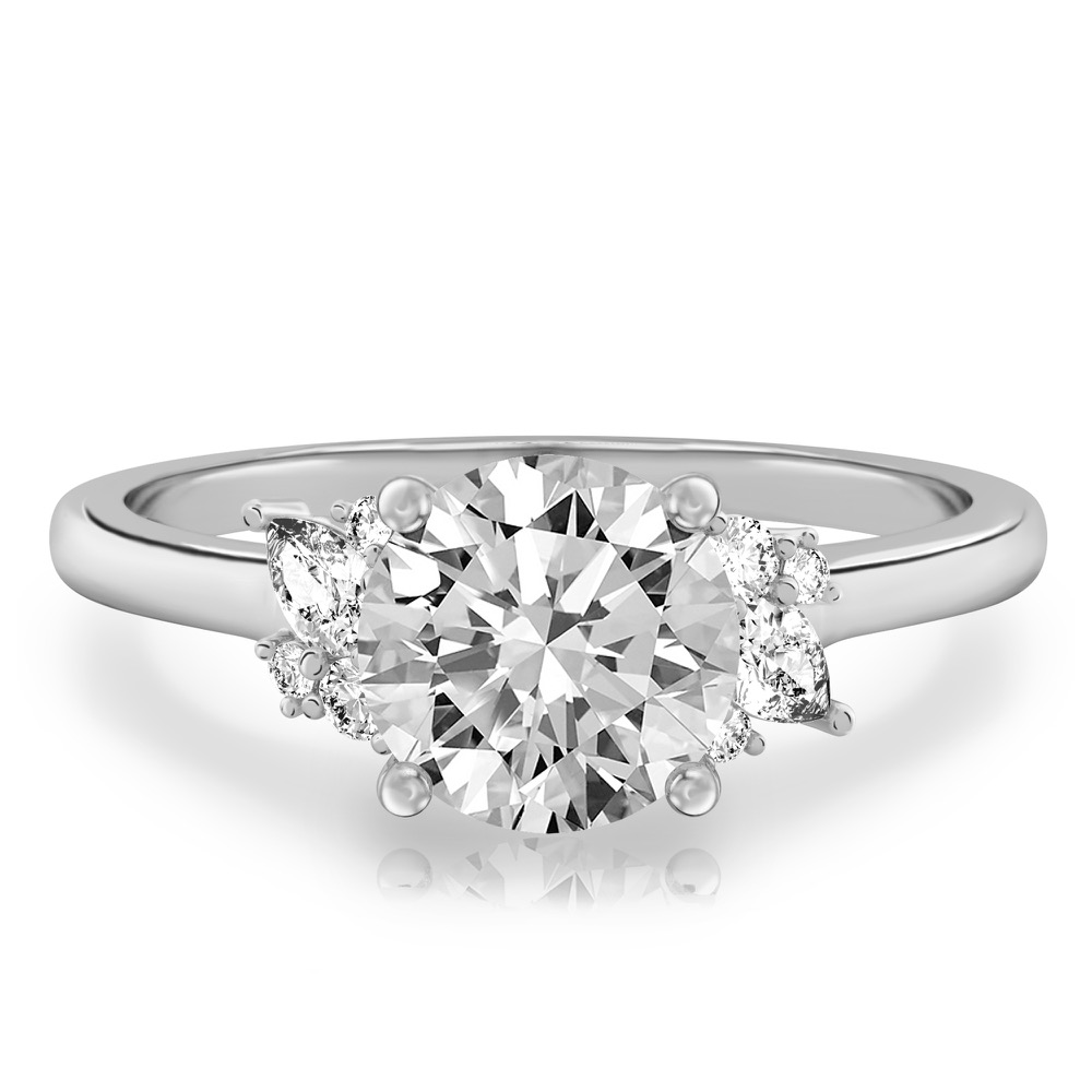 white gold engagement ring with clusters of round and pear diamonds around the center stone