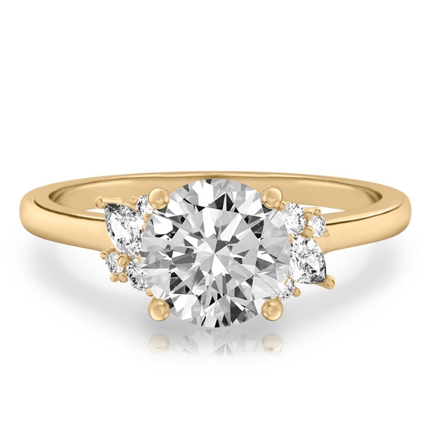 yellow gold engagement ring with clusters of round and pear diamonds around the center stone