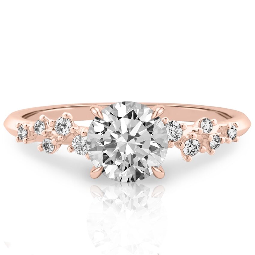 scattered diamond engagement ring with round center stone rose gold