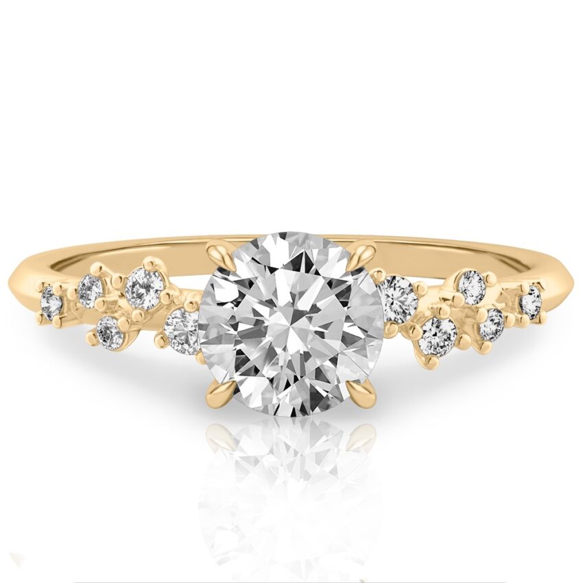 scattered diamond engagement ring with round center stone yellow gold