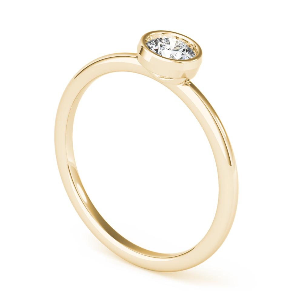 angle view of round bezel stackable rings yellow gold