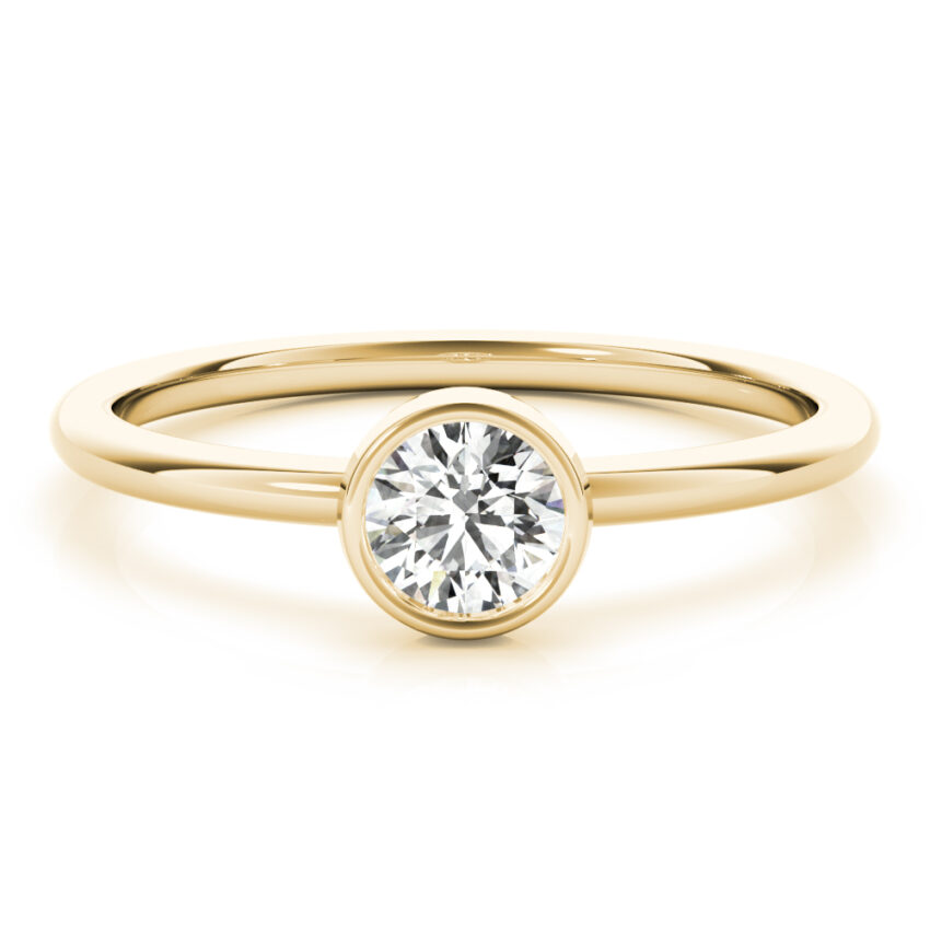 ring with round bezel and lab created diamond in yellow gold