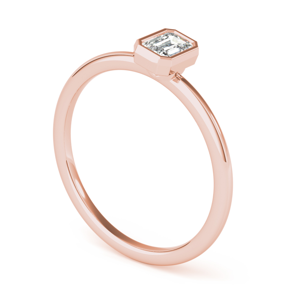 angle view of emerald bezel stackable rings rose gold