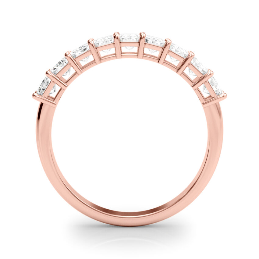 rose gold emerald diamond anniversary band with diamonds that go almost halfway down the band