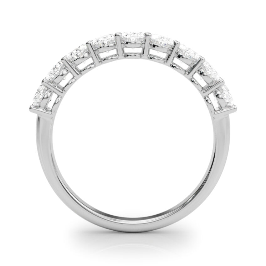 white gold oval anniversary band with diamonds that go almost halfway down the band