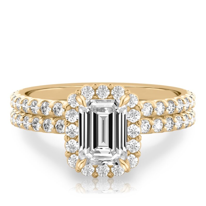 emerald cut diamond scalloped halo engagement ring set in yellow gold