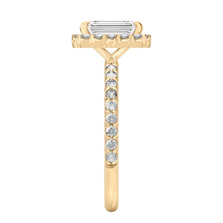 Side view of emerald cut diamond scalloped halo engagement ring yellow gold