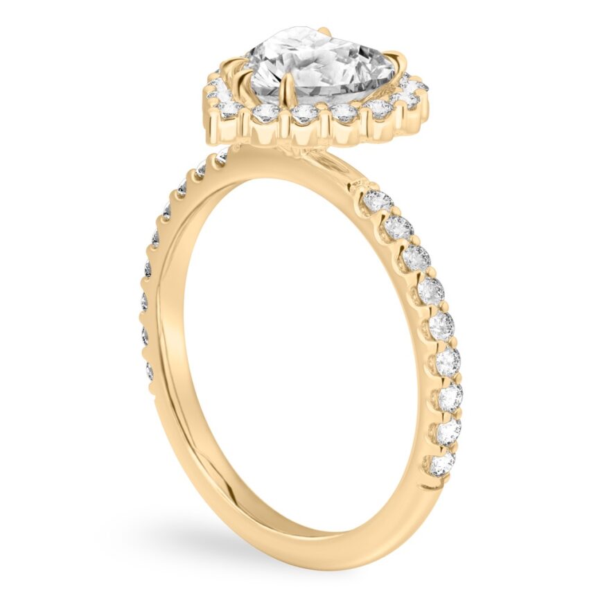 Angle view of heart shape diamond scalloped halo engagement ring yellow gold