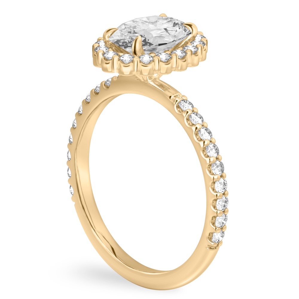 Angle view of oval shape diamond scalloped halo engagement ring yellow gold