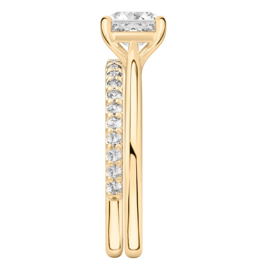 Side view of asscher cut diamond cathedral solitaire engagement ring set yellow gold