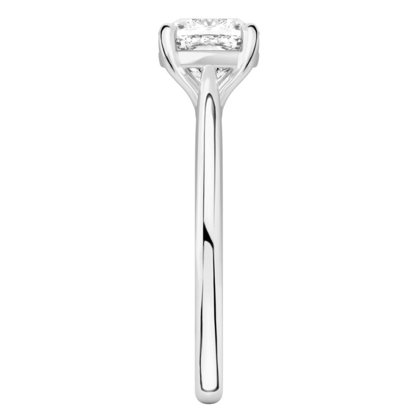 Side view of cushion cut diamond cathedral solitaire engagement ring platinum