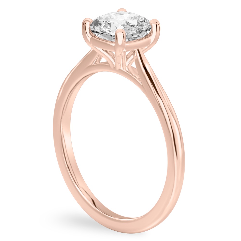 Angle view of cushion cut diamond cathedral solitaire engagement ring rose gold