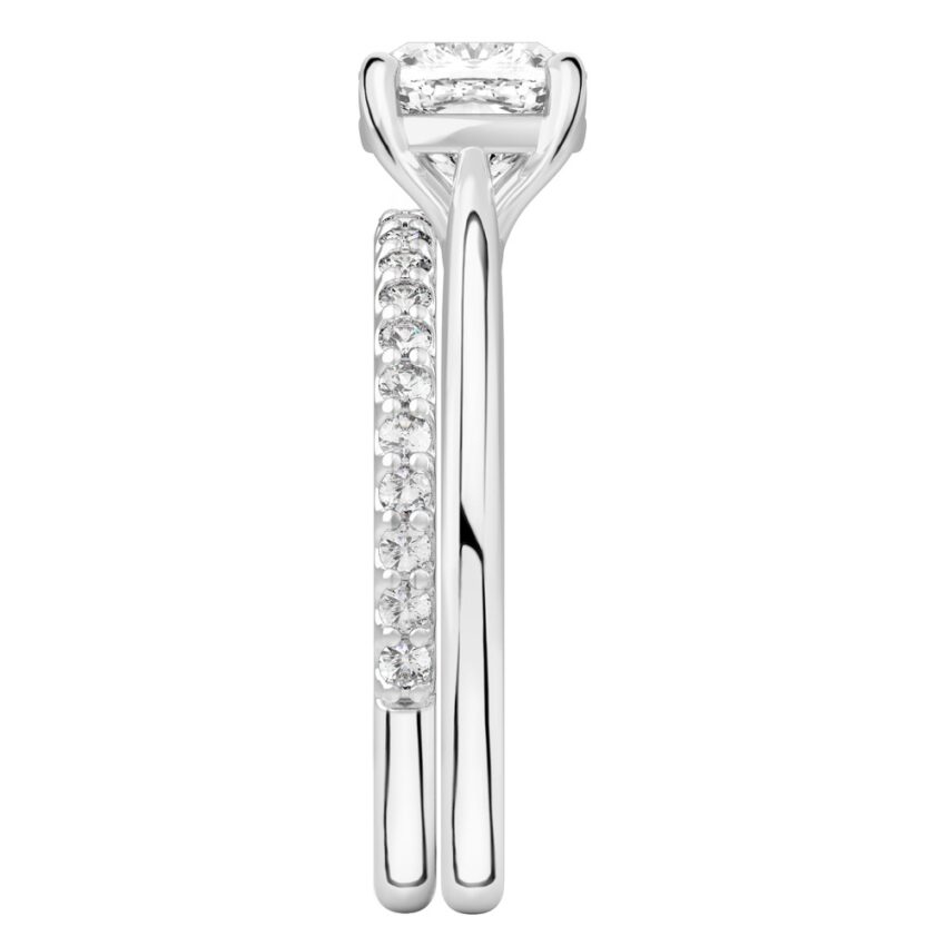 Side view of cushion cut diamond cathedral solitaire engagement ring set platinum