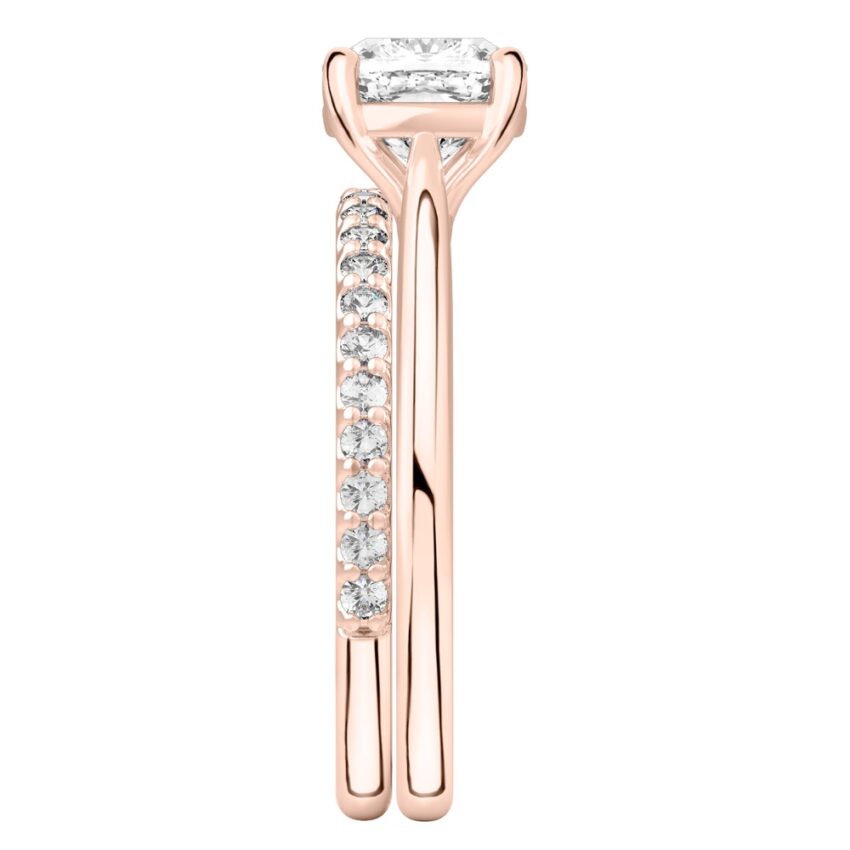 Side view of cushion cut diamond cathedral solitaire engagement ring set rose gold