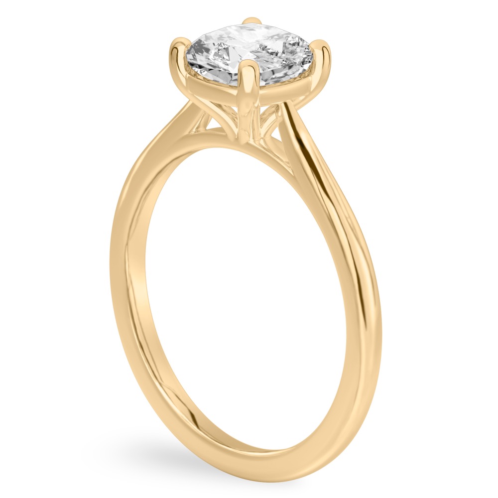 Angle view of cushion cut diamond cathedral solitaire engagement ring yellow gold