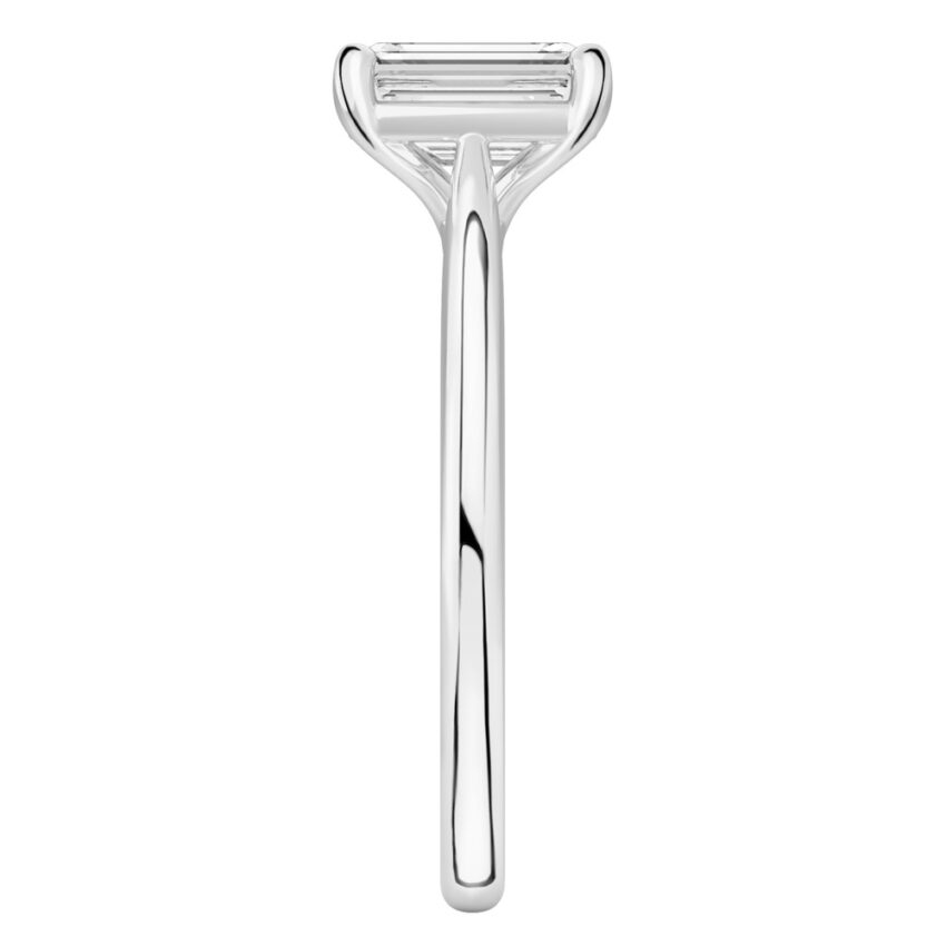 Side view of emerald cut diamond cathedral solitaire engagement ring palladium