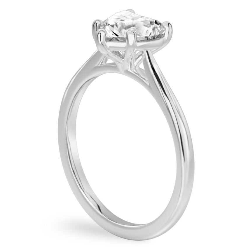 Angle view of heart shape diamond cathedral solitaire engagement ring palladium