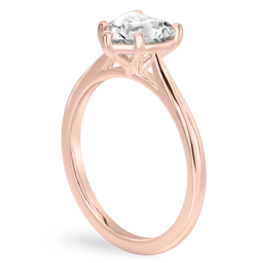 Angle view of heart shape diamond cathedral solitaire engagement ring rose gold